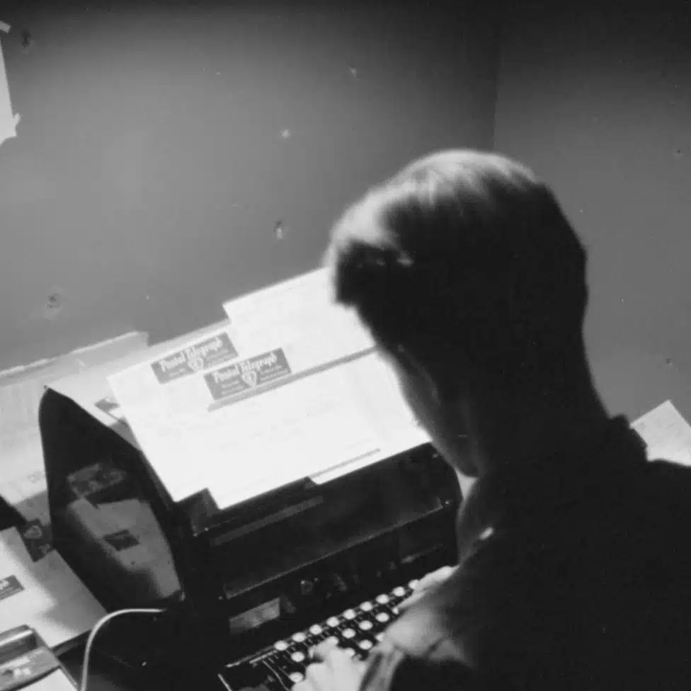 Kubernetes patching runway illustration: person typing on a typewriter