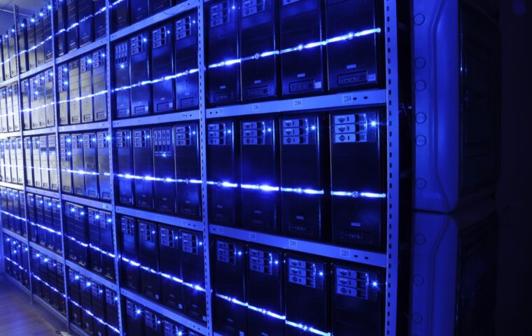 Rows of data center servers representing the infrastructure behind AI operations