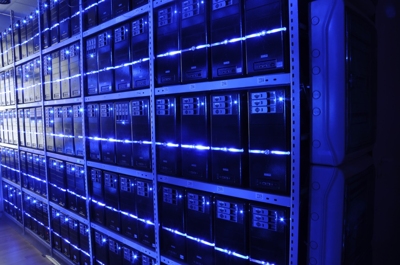 Rows of data center servers representing the infrastructure behind AI operations