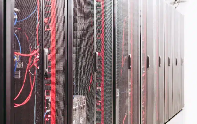 Server racks and network cables in a modern data centre