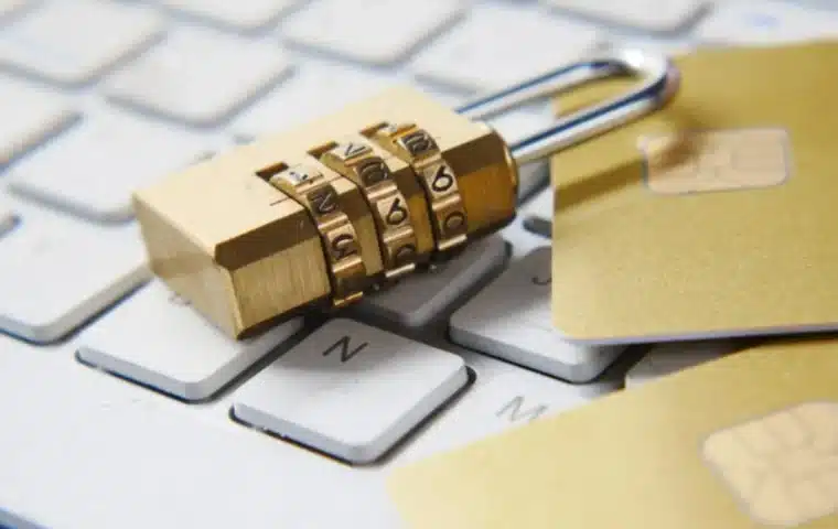Golden padlock on a computer keyboard representing identity-bound AI access